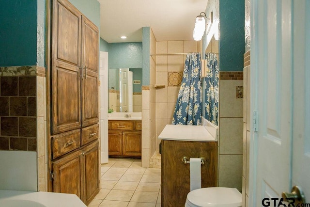 full bath featuring curtained shower, tile walls, toilet, and tile patterned floors