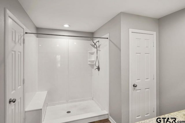 full bathroom featuring a stall shower