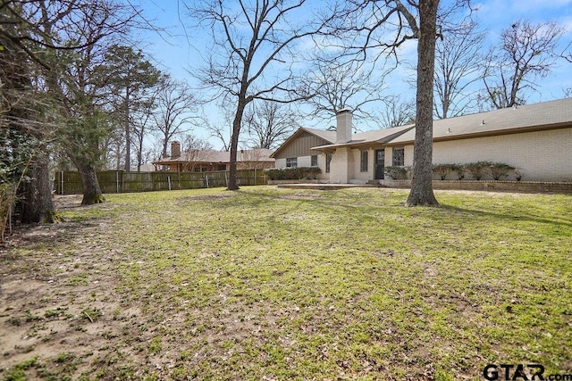 view of yard featuring fence