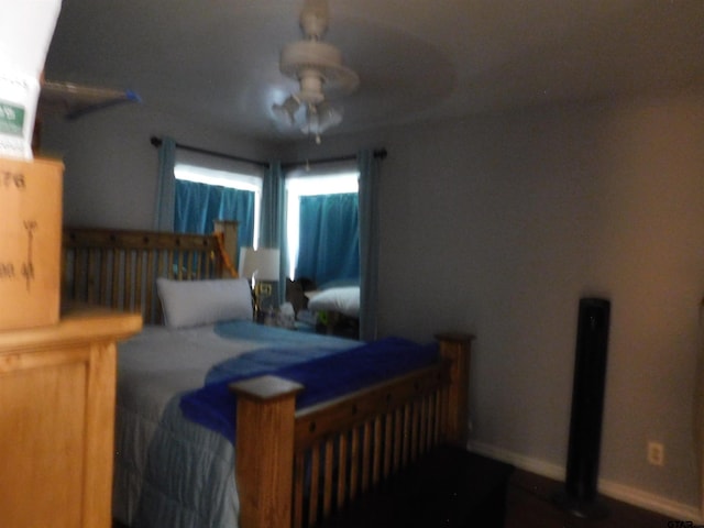 bedroom featuring baseboards