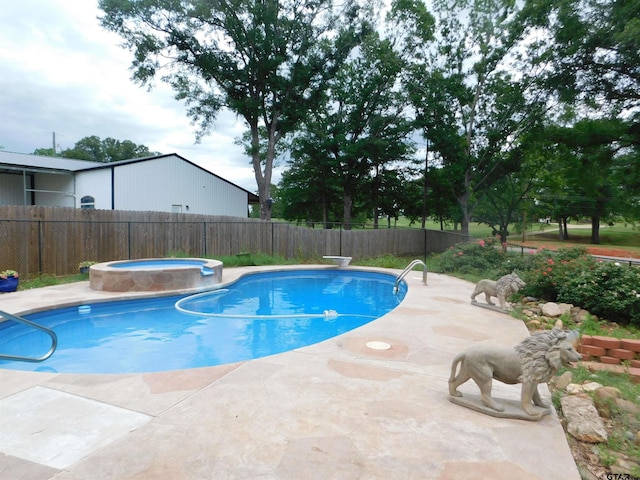 view of pool featuring fence, a fenced in pool, an in ground hot tub, and a patio