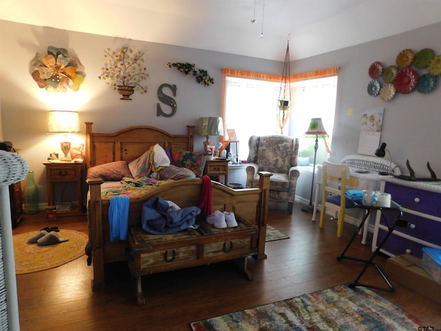 bedroom with wood-type flooring