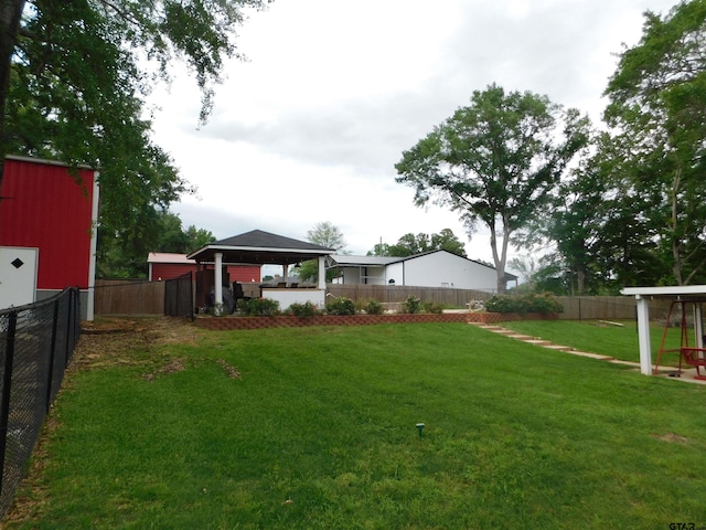 view of yard with a fenced backyard and a gazebo
