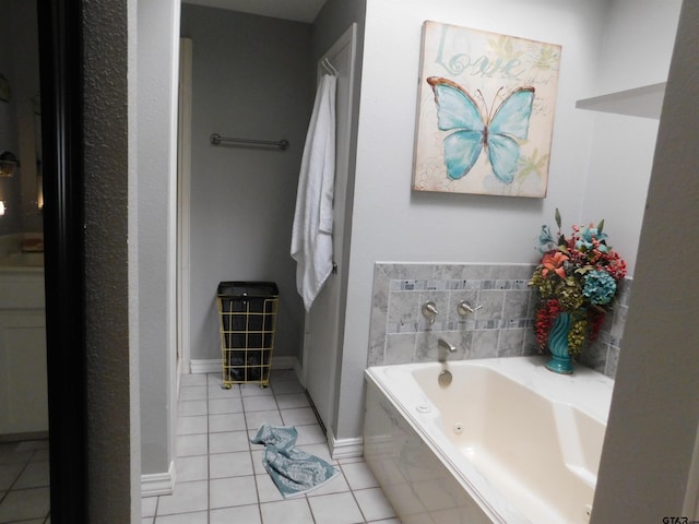 full bathroom featuring a garden tub and tile patterned floors