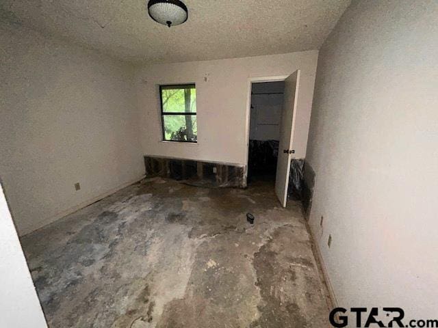 interior space with unfinished concrete floors