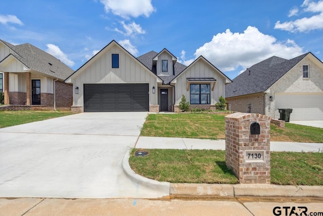 7130 Alexander Dr, Tyler, TX 75707 - modern inspired farmhouse featuring board and batten siding, a garage, driveway, and a front yard