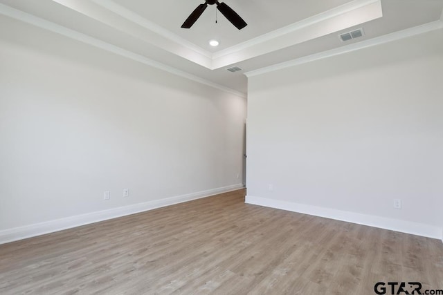 7130 Alexander Dr, Tyler, TX 75707 - spare room with wood finished floors, crown molding, a ceiling fan, a raised ceiling, and recessed lighting