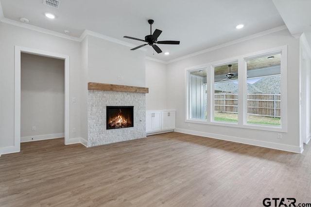 7130 Alexander Dr, Tyler, TX 75707 - unfurnished living room featuring a ceiling fan, wood finished floors, crown molding, a fireplace, and recessed lighting