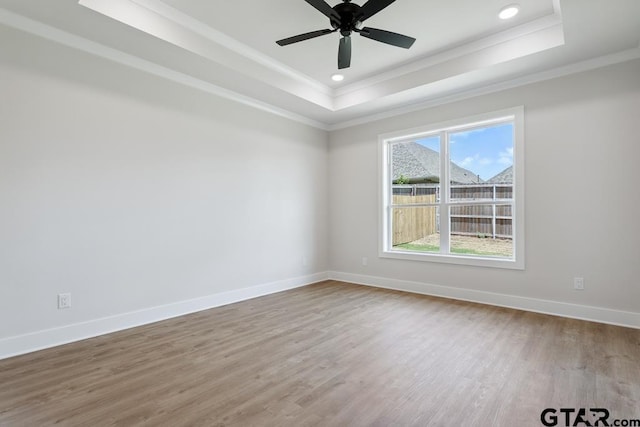 7130 Alexander Dr, Tyler, TX 75707 - unfurnished room featuring a raised ceiling, ornamental molding, wood finished floors, recessed lighting, and a ceiling fan