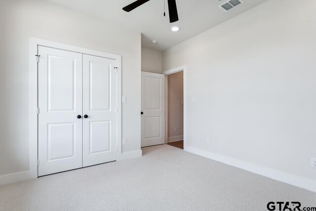 7130 Alexander Dr, Tyler, TX 75707 - unfurnished bedroom featuring carpet flooring, a closet, and a ceiling fan