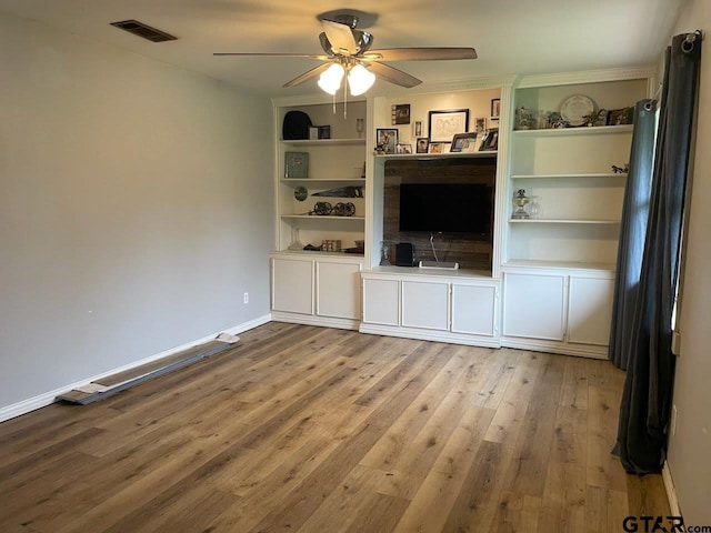 unfurnished living room featuring baseboards, visible vents, ceiling fan, and wood-type flooring