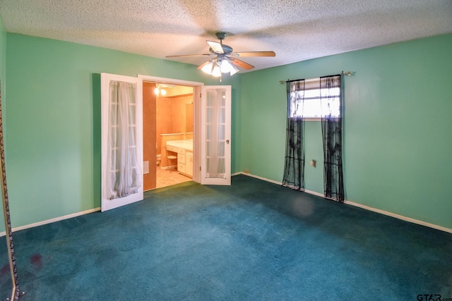 empty room featuring french doors, carpet floors, a textured ceiling, and ceiling fan