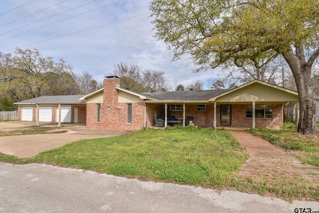 single story home with a garage and a front lawn