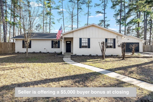 2513 Memory Ln, Tyler, TX 75701 - ranch-style home featuring fence, a garage, and brick siding