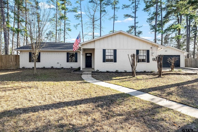2513 Memory Ln, Tyler, TX 75701 - single story home featuring an attached garage, fence, and brick siding