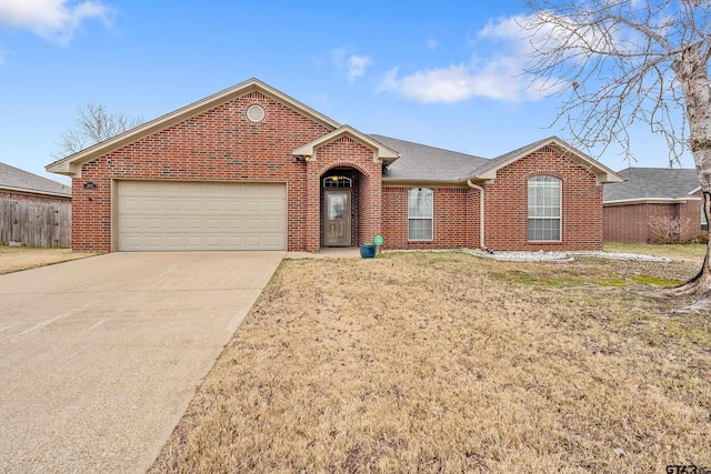 ranch-style house with a front yard and a garage