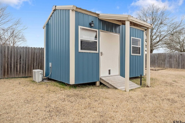 view of outdoor structure with a lawn