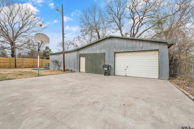 garage featuring fence