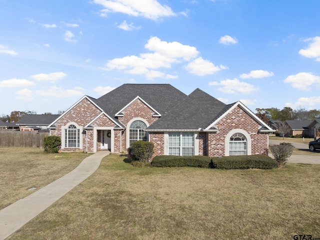 view of front of property with a front lawn