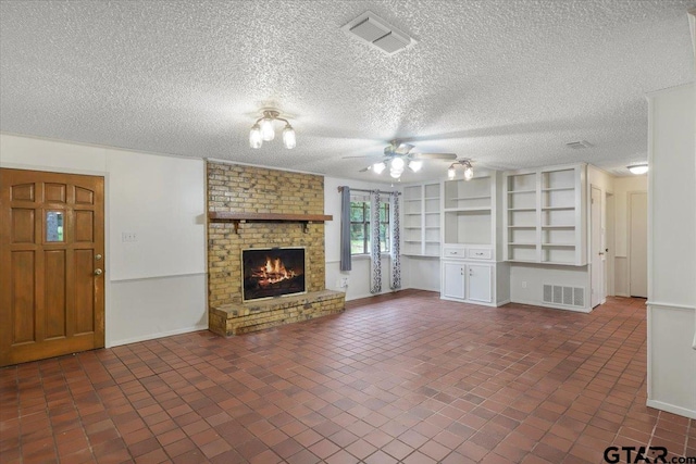 2278 Fm 1799, Mineola, TX 75773 - unfurnished living room with ceiling fan, baseboards, a brick fireplace, and a textured ceiling