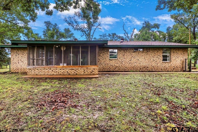 2278 Fm 1799, Mineola, TX 75773 - back of house featuring brick siding and a sunroom