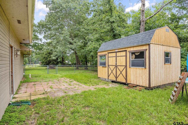 1805 San Saba Dr, Bullard, TX 75757 - view of yard with a storage unit, a patio area, and view of scattered trees