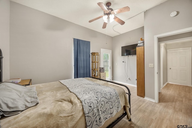 1805 San Saba Dr, Bullard, TX 75757 - bedroom with vaulted ceiling, light wood-style flooring, and ceiling fan