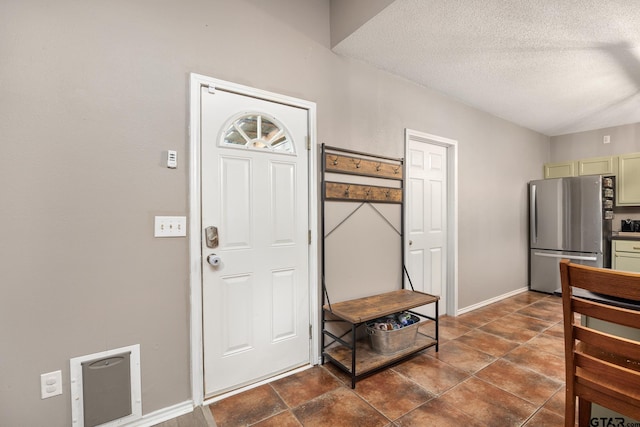 1805 San Saba Dr, Bullard, TX 75757 - entrance foyer with a textured ceiling and baseboards