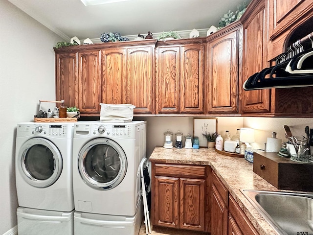 599 N Weldon St, Frankston, TX 75763 - laundry room featuring cabinet space, separate washer and dryer, and ornamental molding