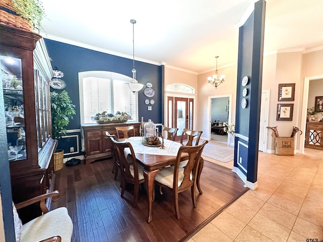 599 N Weldon St, Frankston, TX 75763 - dining room featuring crown molding, a chandelier, baseboards, and wood finished floors