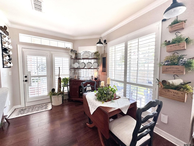 599 N Weldon St, Frankston, TX 75763 - dining area with ornamental molding and dark wood finished floors