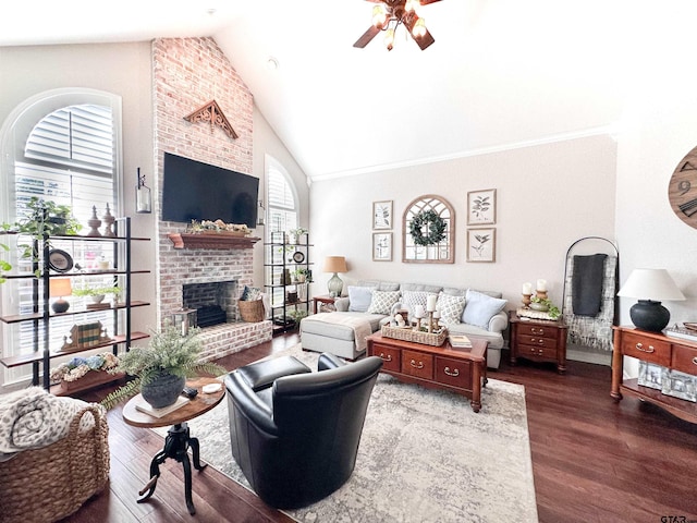 599 N Weldon St, Frankston, TX 75763 - living area with a ceiling fan, dark wood finished floors, high vaulted ceiling, and a brick fireplace