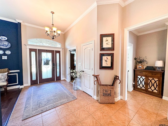 599 N Weldon St, Frankston, TX 75763 - foyer featuring a chandelier, crown molding, light tile patterned floors, baseboards, and a towering ceiling