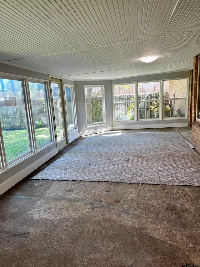 unfurnished sunroom featuring a healthy amount of sunlight