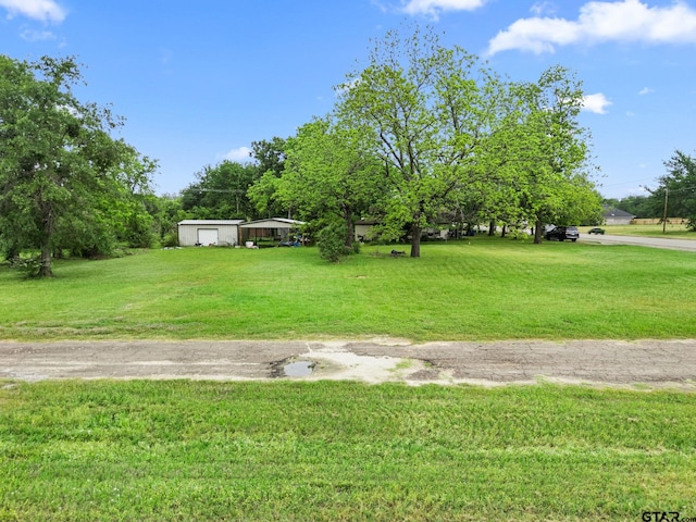view of yard with a detached carport