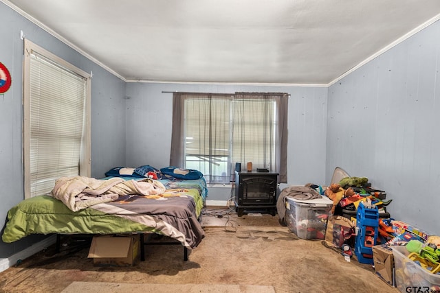 carpeted bedroom featuring crown molding and a wood stove