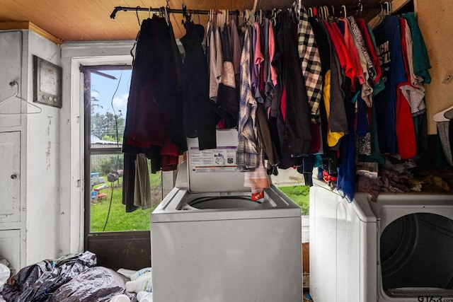 washroom with separate washer and dryer and laundry area