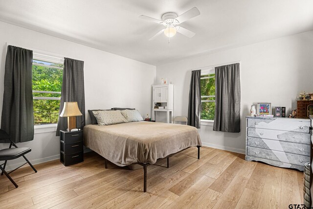 298 Butler St, Rusk, TX 75785 - bedroom featuring light wood finished floors, baseboards, and a ceiling fan