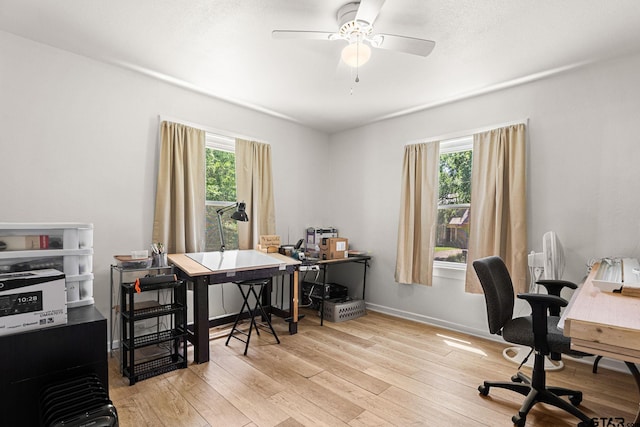 298 Butler St, Rusk, TX 75785 - office area with light wood-style flooring, plenty of natural light, ceiling fan, and baseboards