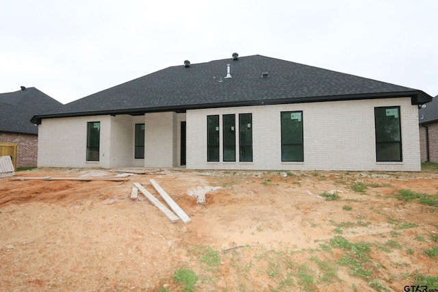11905 Gillian Ct, Tyler, TX 75703 - back of property with brick siding and a shingled roof