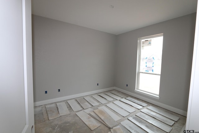 11905 Gillian Ct, Tyler, TX 75703 - unfurnished room with baseboards and plenty of natural light