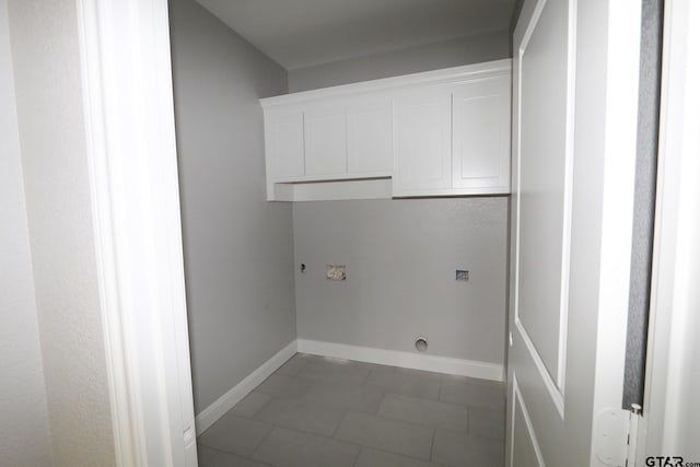 11905 Gillian Ct, Tyler, TX 75703 - washroom featuring cabinet space, electric dryer hookup, and baseboards