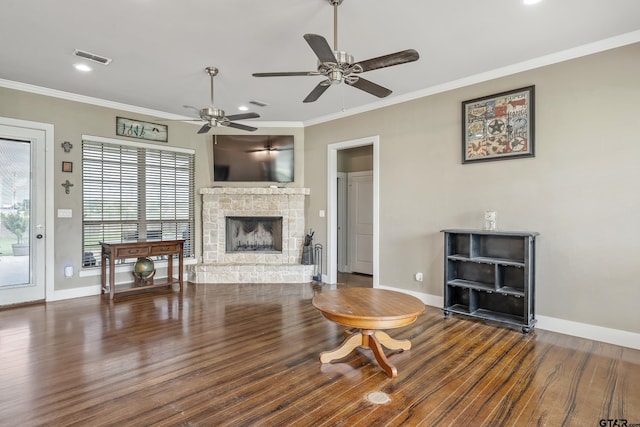275 Babatwa Ln, Bullard, TX 75757 - living room featuring ceiling fan, a stone fireplace, ornamental molding, wood finished floors, and recessed lighting