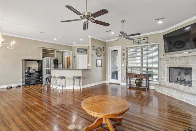 275 Babatwa Ln, Bullard, TX 75757 - living room featuring ceiling fan, a stone fireplace, wood finished floors, recessed lighting, and ornamental molding