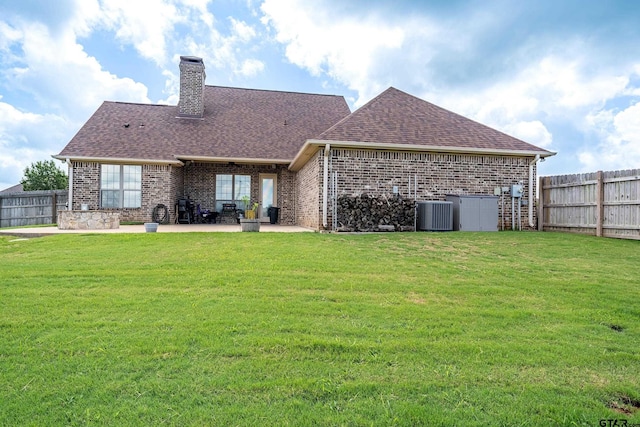 275 Babatwa Ln, Bullard, TX 75757 - back of property with brick siding, a chimney, roof with shingles, and a patio area