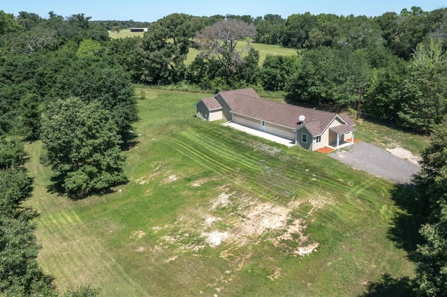 birds eye view of property with a rural view