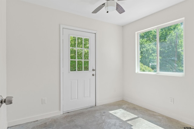 interior space with ceiling fan