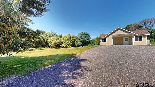 ranch-style house with a front lawn