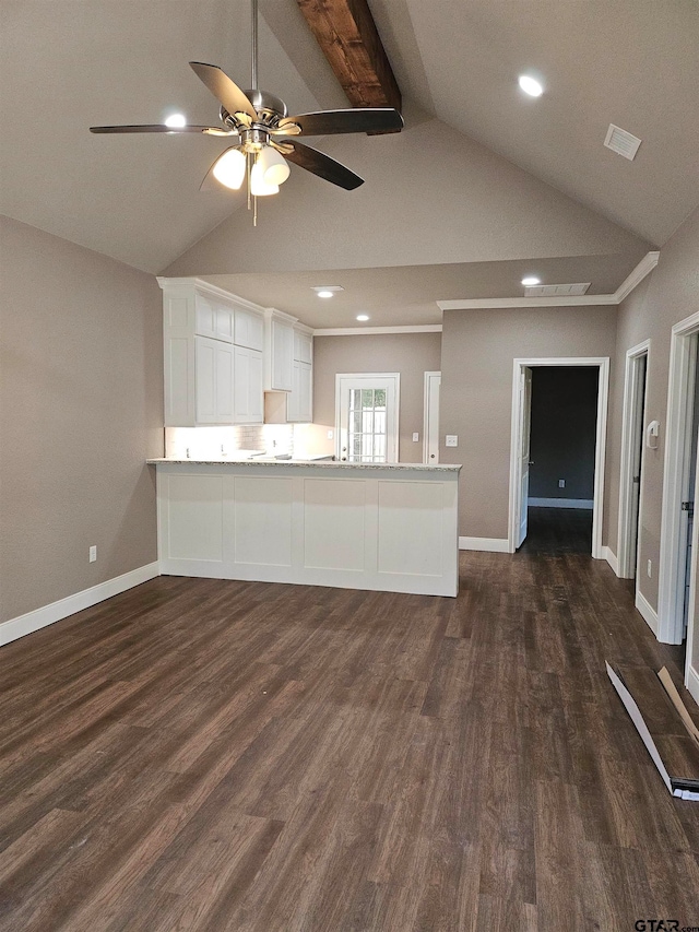 kitchen featuring kitchen peninsula, ceiling fan, vaulted ceiling with beams, white cabinets, and dark hardwood / wood-style flooring