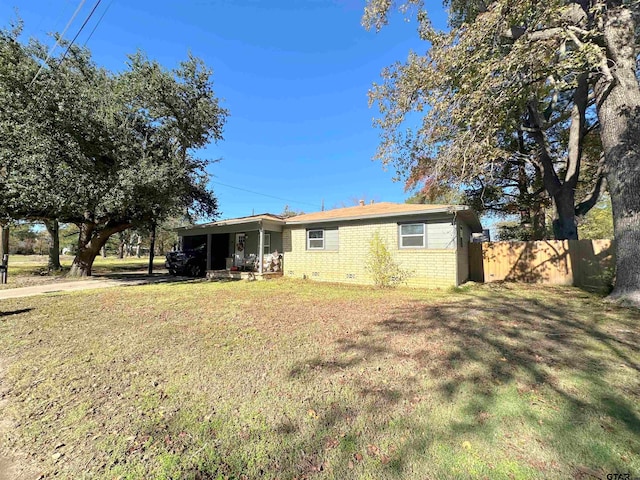 rear view of house with a lawn